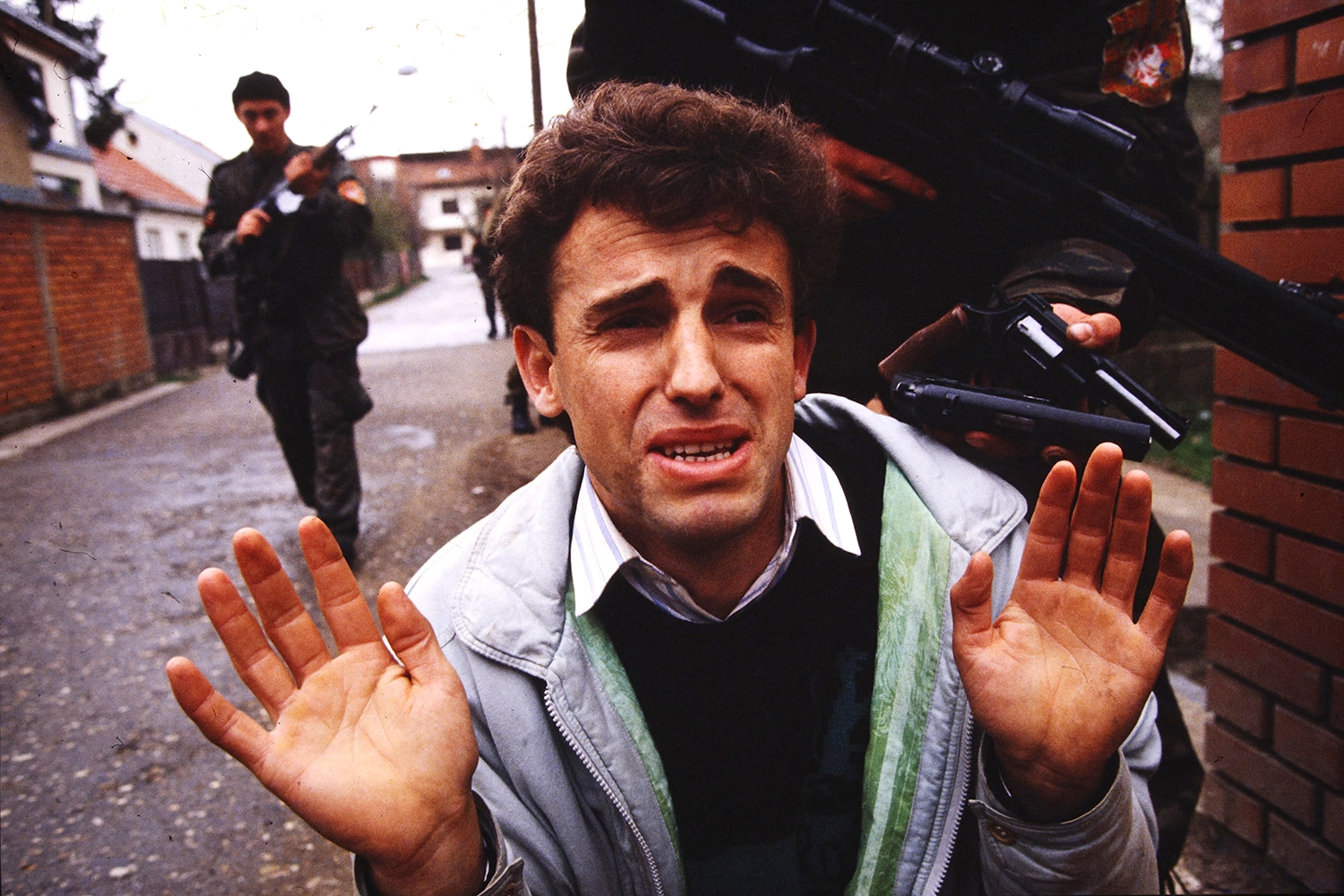 Hajrush Ziberi begs for his life as members of Arkan's Tigers detain him. He was later found dead.