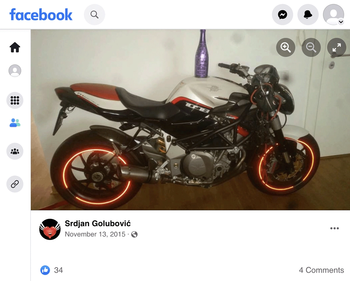 The cover photo of Srđan Golubović’s Facebook profile features a bottle of Taittinger champagne on a motorcycle.