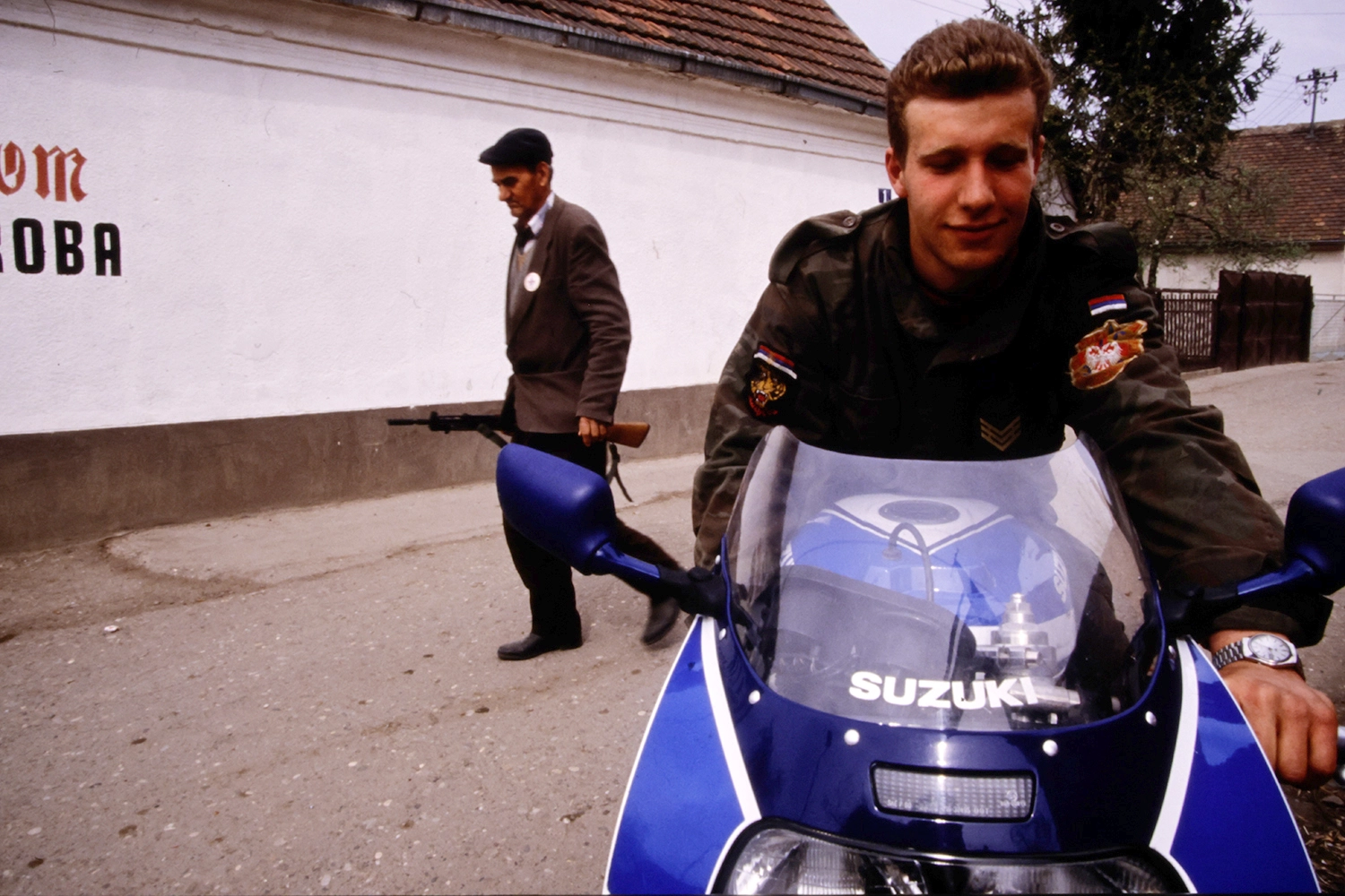 A member of Arkan's Tigers, who appears similar to more recent photos taken of Srđan Golubović, is pictured on a motorcycle in Bijeljina, on April 2, 1992.